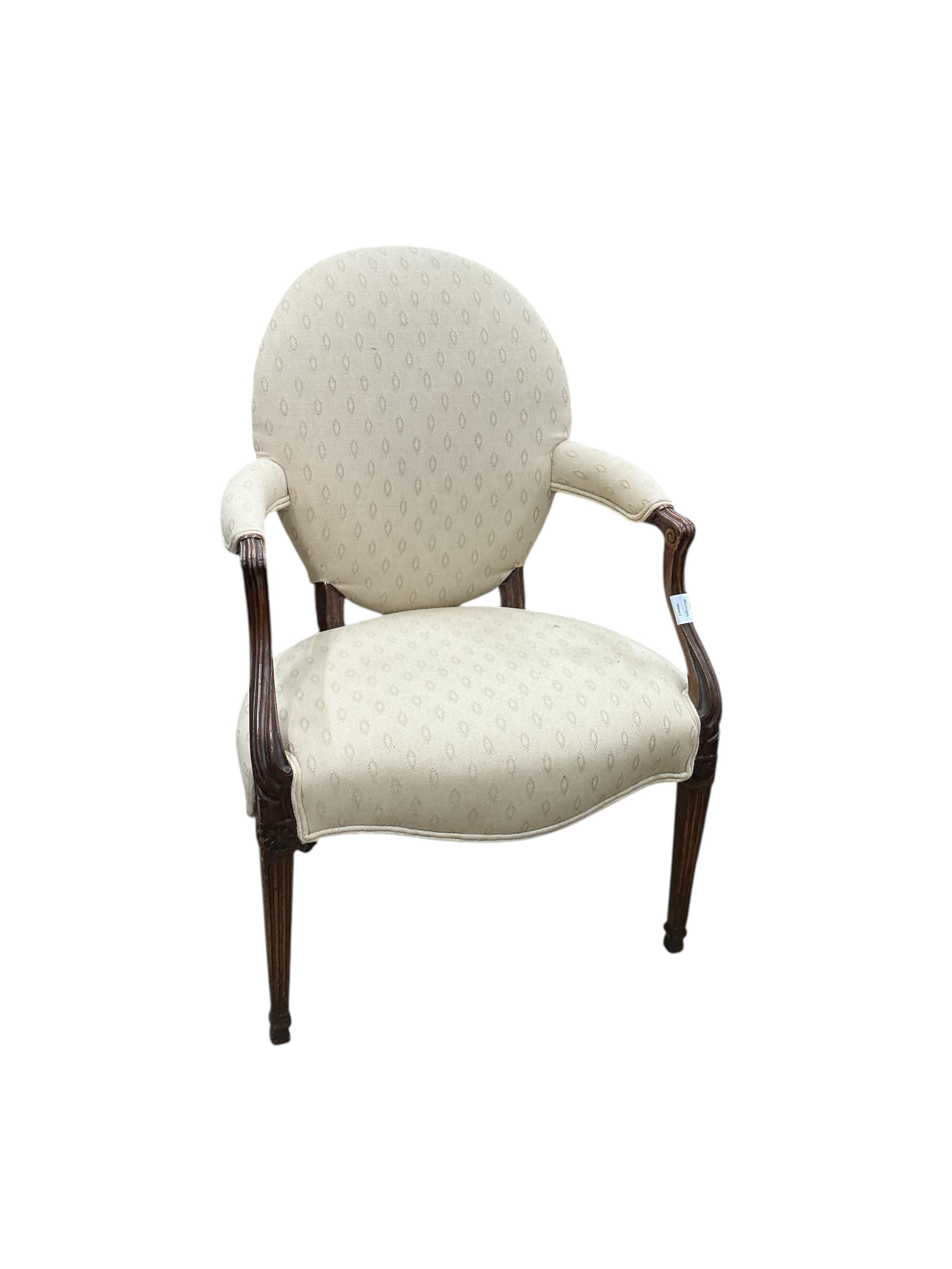 A George III Hepplewhite style upholstered mahogany elbow chair, width 61cm, depth 44cm, height 94cm